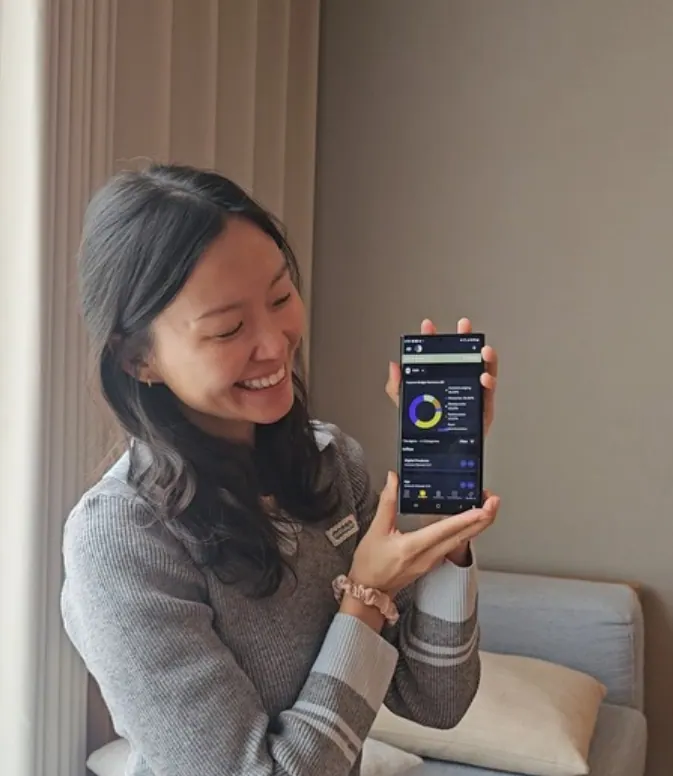 Melanie presenting a product on her phone