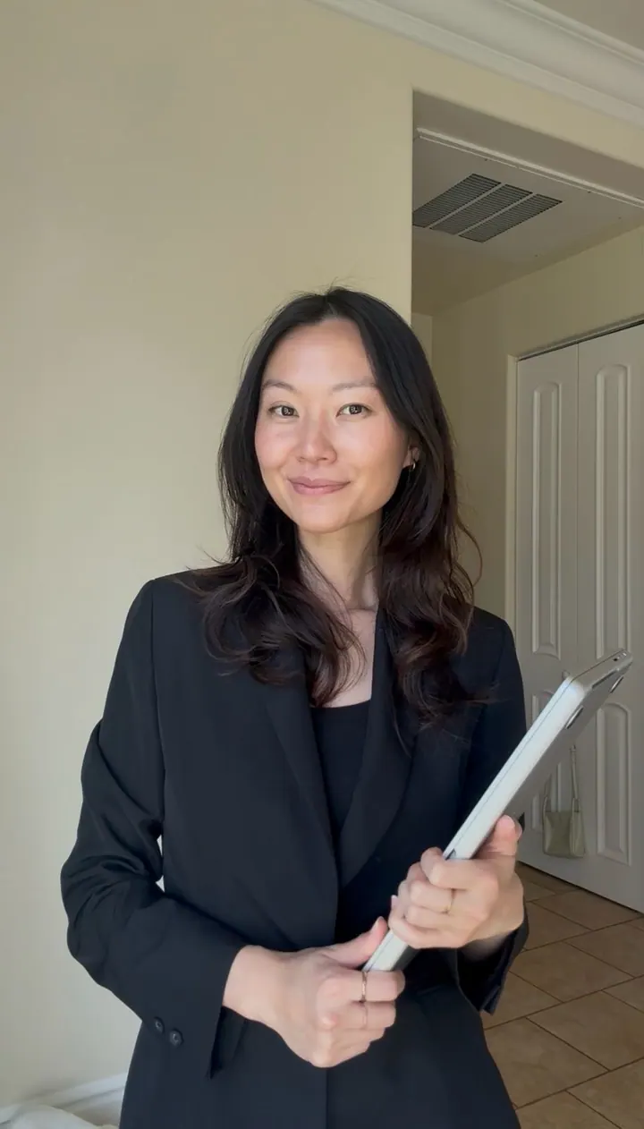 Melanie Renee holding a tablet